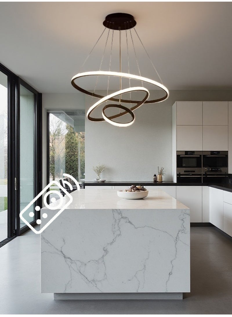 An LED chandelier composed of three light rings, stylish and simple. It has three light colors, adjustable in shape, and can be controlled by remote control or switch. It is suitable for above the dining table, living room, bedroom and study. - Image 1